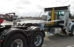 DC802 System with TORC™ Pivot Technology for tandem or multi-axle roll offs and hooklifts hauling similar sized containers using up to 30 feet of tarp.